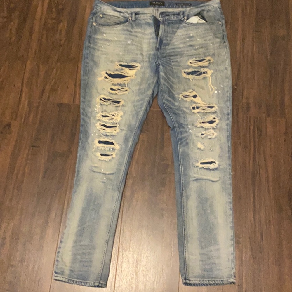 Blue distressed skinny jeans